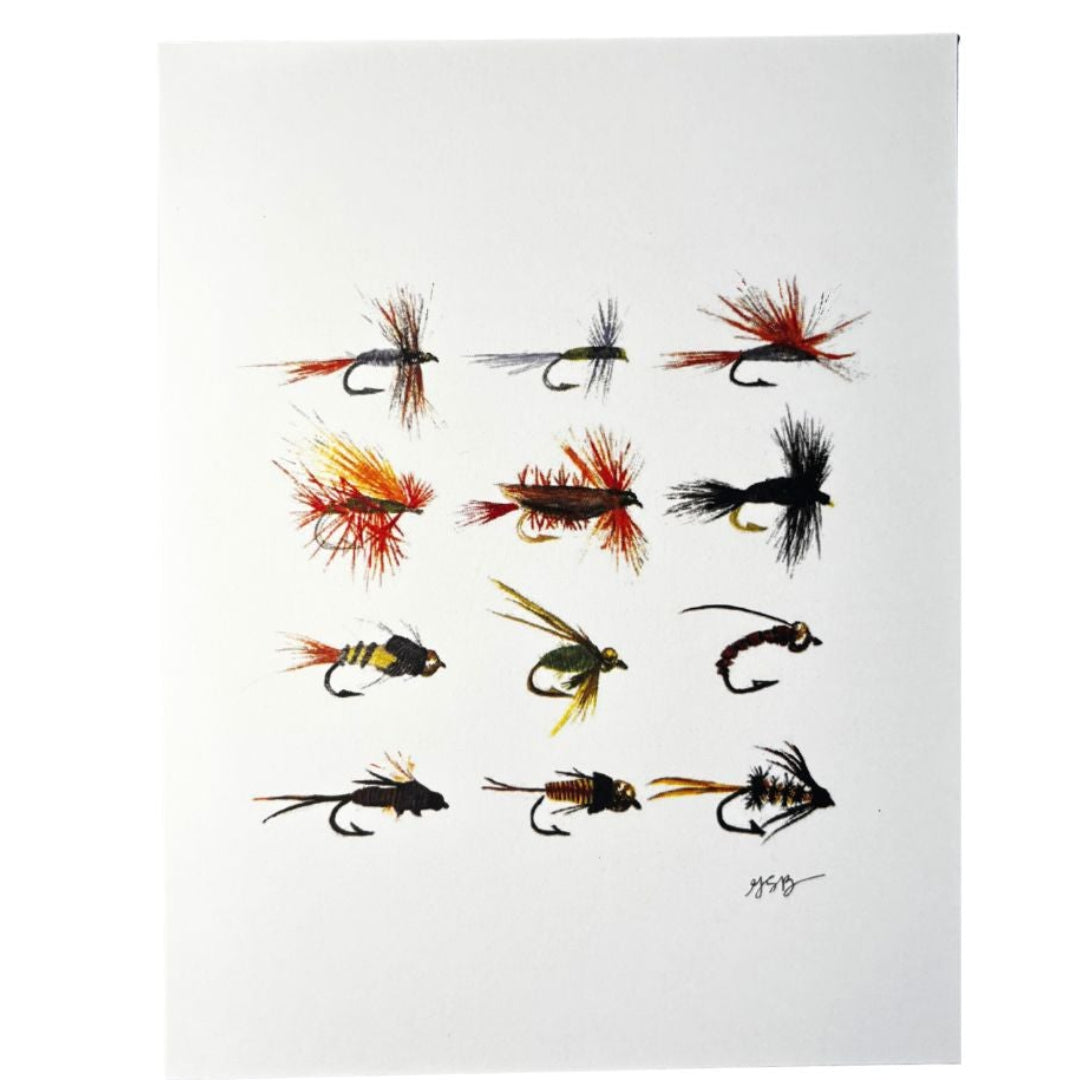 Collection of various fly fishing lures on a white background